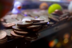 Coins on the edge of a arcade game