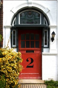 Red front door with a big two painted in black