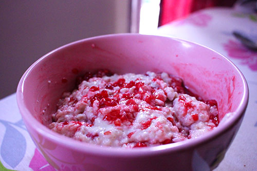 raspberry porridge in a pink bowl