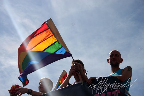 rainbow flag at brighton pride being waved